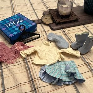 4 American girl outfits   $15 each.